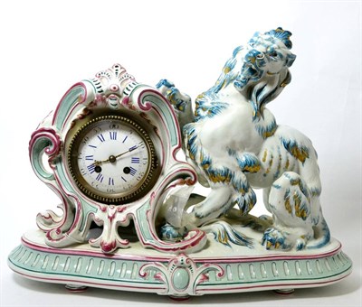 Lot 156 - A ceramic striking mantel clock, circa 1900, the pink, blue and gilt decorated case depicting a...