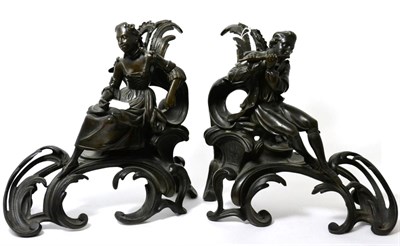 Lot 159 - A pair of bronze chenets in 18th century style, of leaf scroll form surmounted by figures, 31cm...