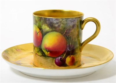 Lot 175 - A Royal Worcester coffee can and saucer, 1923, painted by W H Austin with a still life of fruit