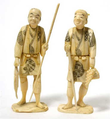 Lot 186 - A pair of Japanese ivory okimonos as a fisherman and a farmer, each holding a staff, on plinth...