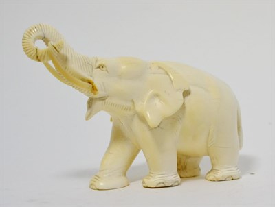 Lot 188 - A Japanese ivory figure of an elephant, Meiji period, 17cm long