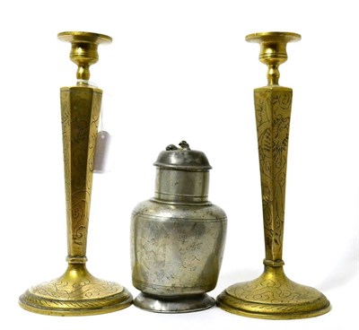 Lot 201 - A Chinese pewter plum wine flask, Qing, 16cm high; and a pair of brass candlesticks with...