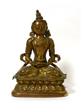 Lot 209 - A gilt brass seated buddha on a lotus throne, 18cm high