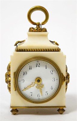 Lot 211 - A white marble desk timepiece, circa 1910, loop handle and gilt metal mounts, enamel dial with...