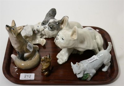 Lot 212 - A Royal Copenhagen porcelain group of two dogs, 20th century, 22cm long; a similar figure of a...