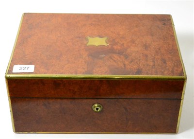 Lot 227 - A Victorian brass bound amboyna jewellery box, applied with a vacant cartouche, 33cm wide