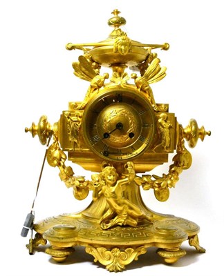 Lot 228 - An ormolu striking mantel clock, circa 1890, urn finial and applied swag, mask, cherub and...