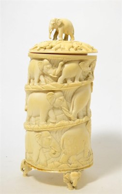 Lot 230 - A Japanese ivory tusk vase, early 20th century, carved with a procession of elephants, 25cm high