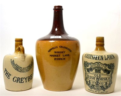 Lot 234 - A Doulton whisky flagon Cowell's Celebrated Whisky, Market Lane, Ipswich, 31cm; and two Glasgow...