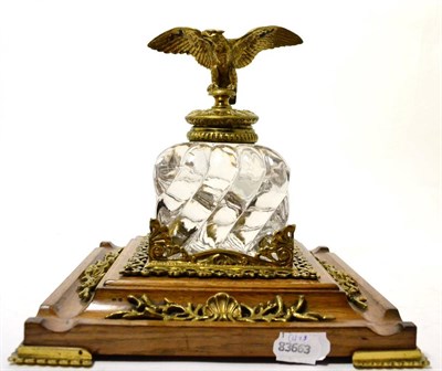 Lot 238 - A gilt metal mounted cut glass and mahogany desk stand, in Empire style, the wrythen square section